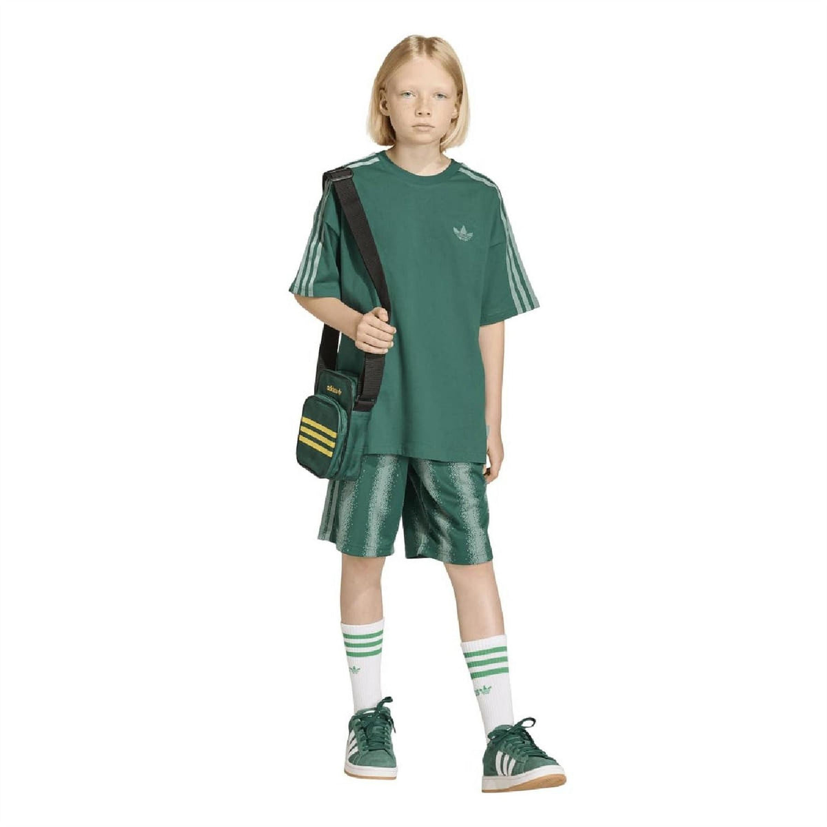 Kids' green speckle-print shorts with drawstring, worn with socks