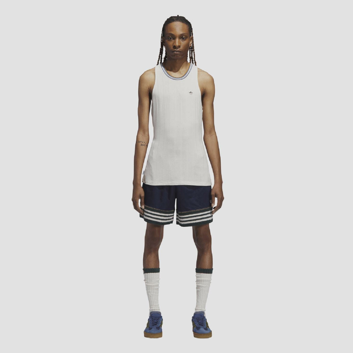 Indigo knit shorts with elastic waistband, striped hem and small trefoil logo