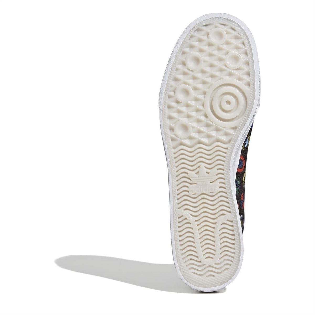 Outsole view of white rubber sole on black hi-top sneakers with colorful upper.