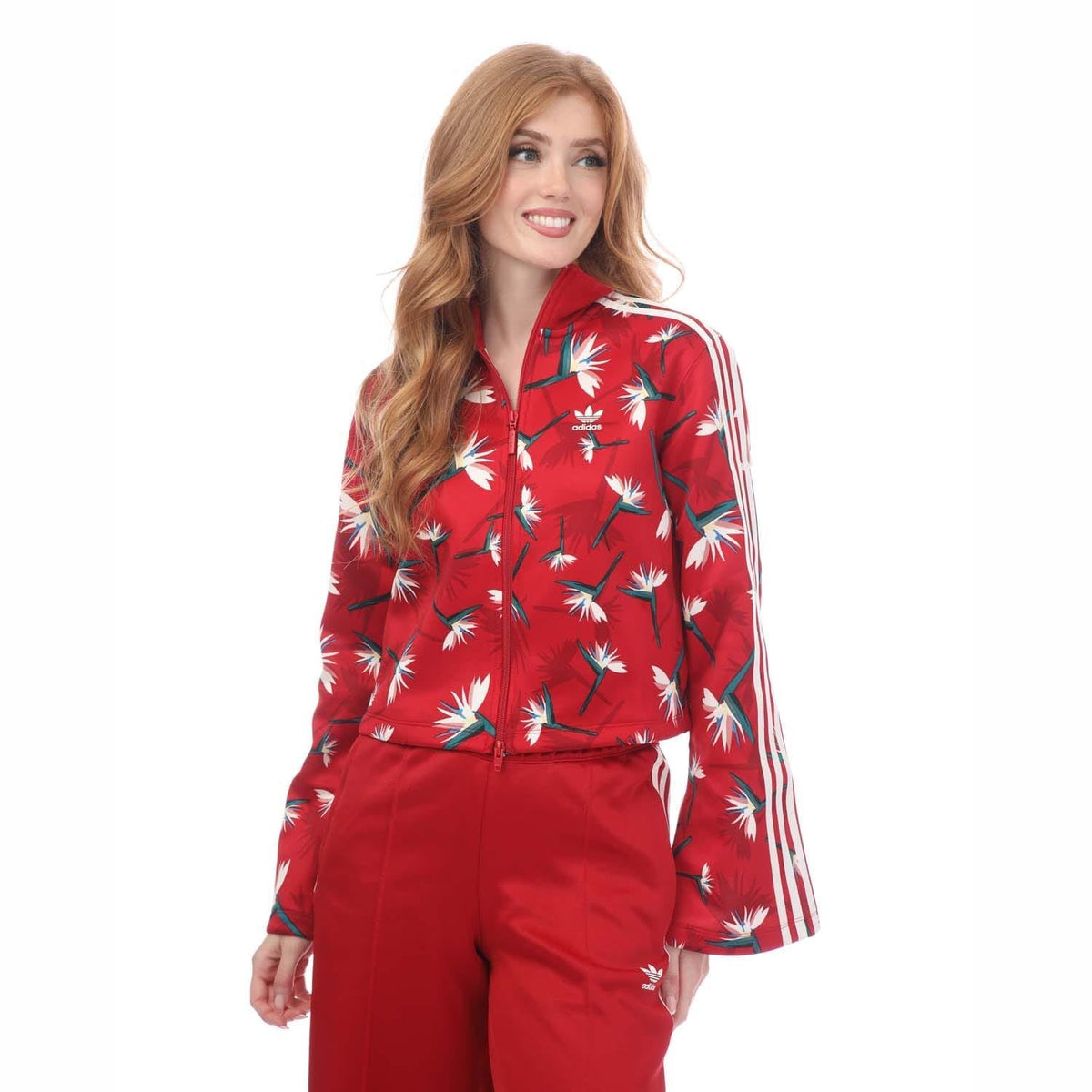 Red floral track jacket with full zip, stand collar, and white stripe sleeves