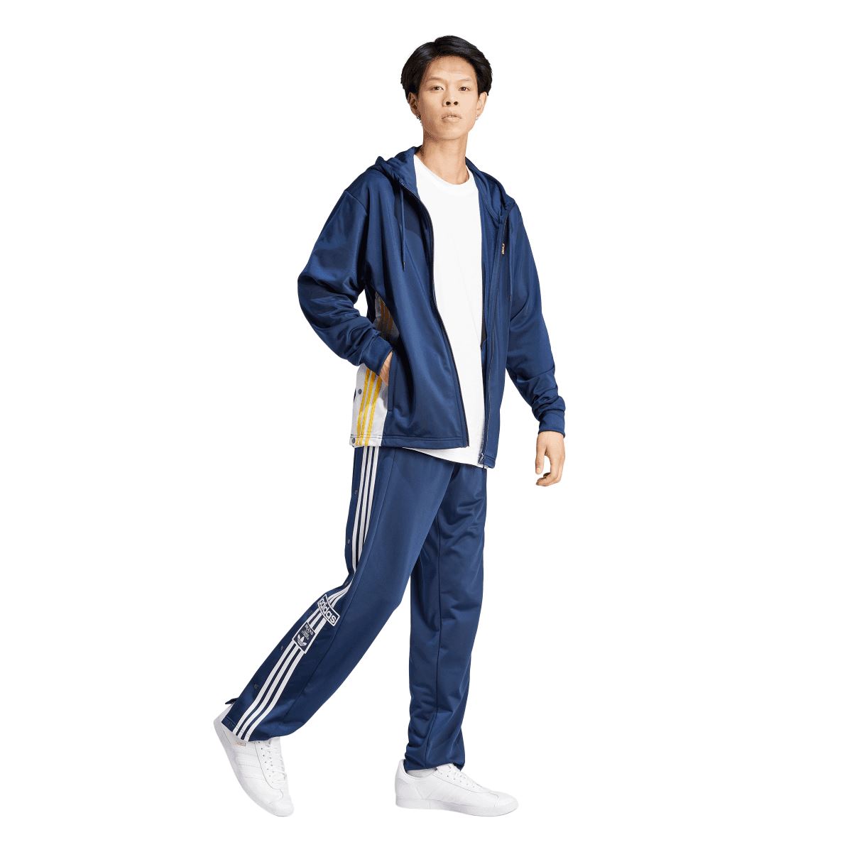 Indigo zip-up hoodie with hood and drawstring, worn over athletic pants