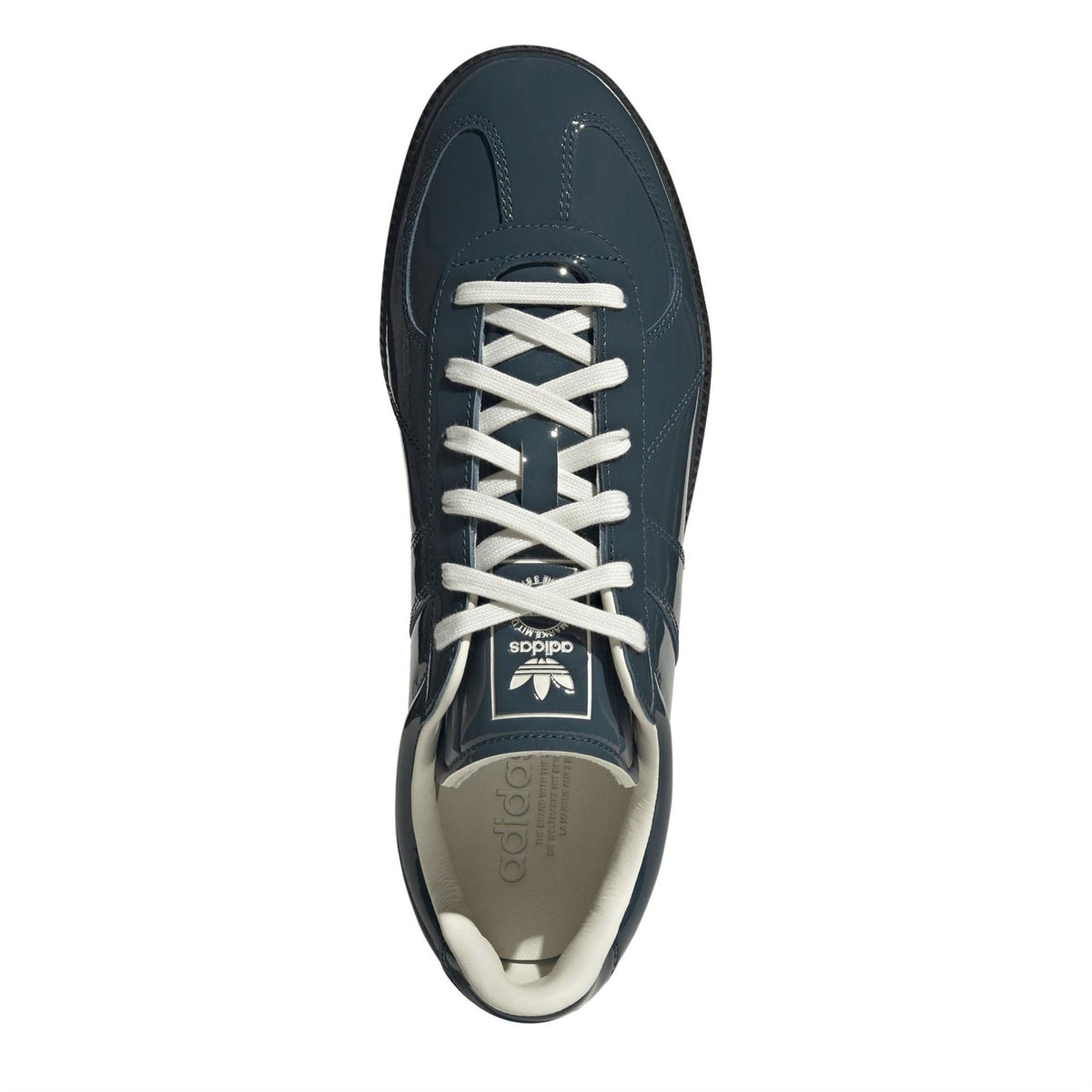 Dark petrol blue adidas Originals shoe with white laces and tongue logo label