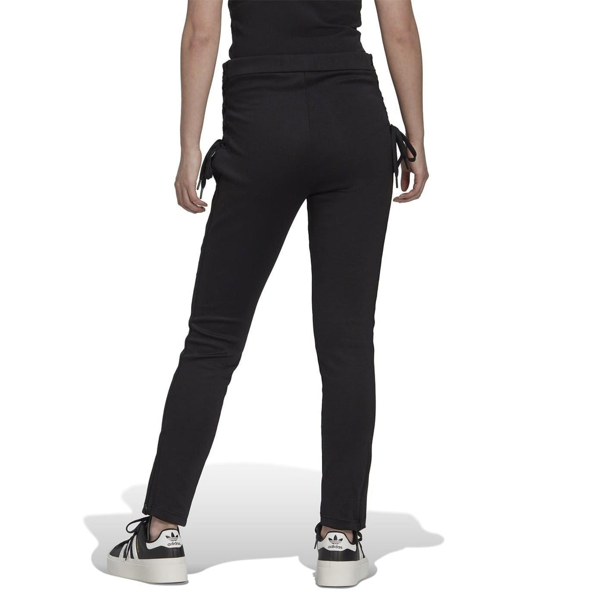 adidas Originals slim fit running joggers, athletic track pants with tapered legs and elastic waistband, black color, front view