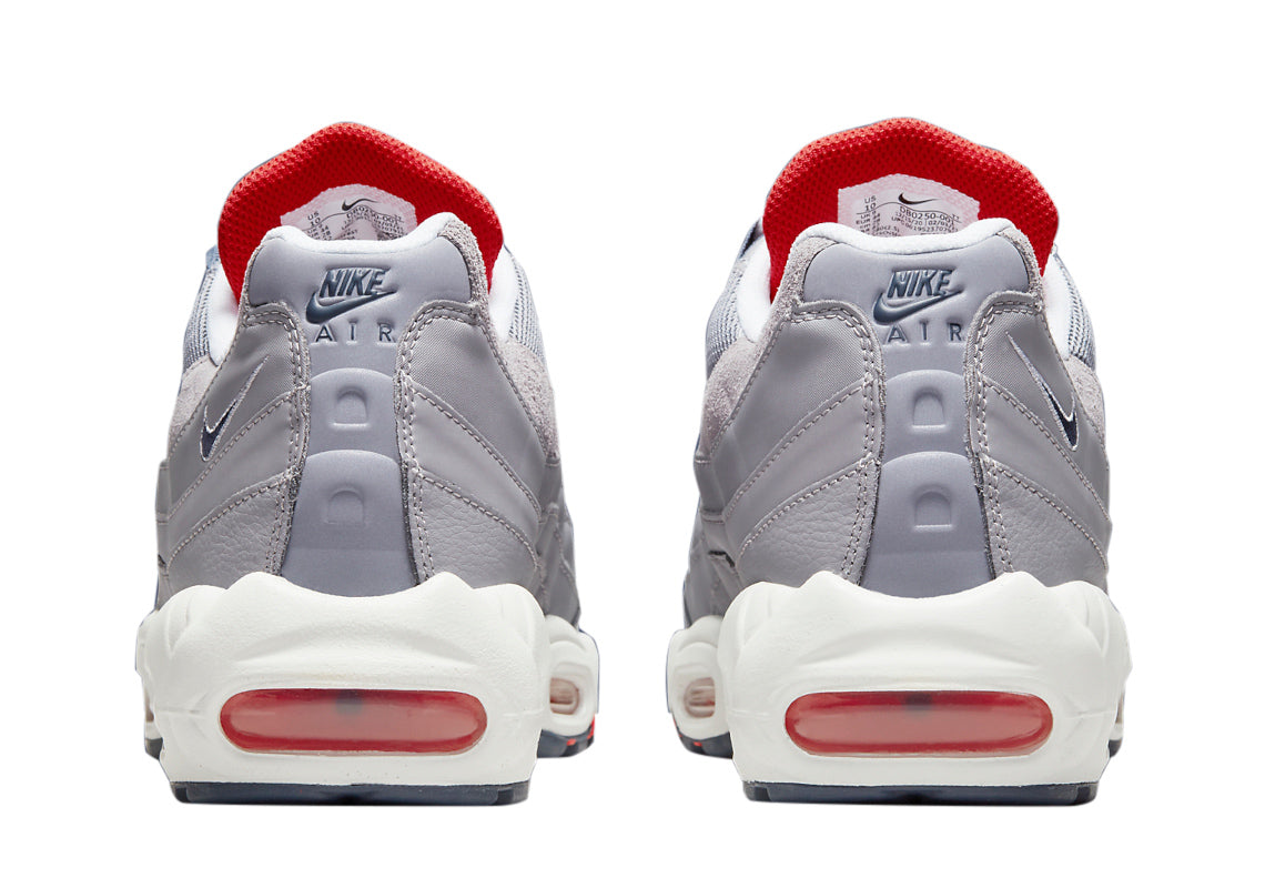 Men's Nike Air Max 95 cement grey sneakers, back view with red heel and white midsole.