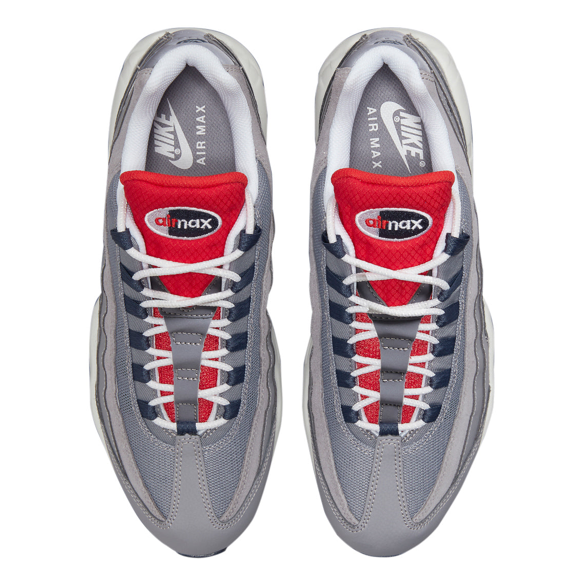 Men's Nike Air Max 95 shoes, top view: grey uppers with red tongues and laced eyelets.