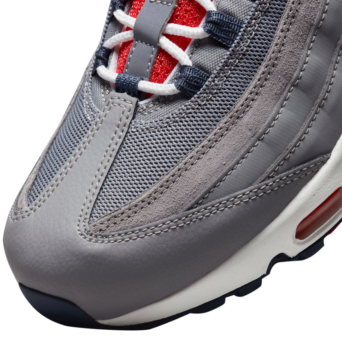 Men's Nike Air Max 95 close-up of grey mesh upper, stitching, and red midfoot air unit.