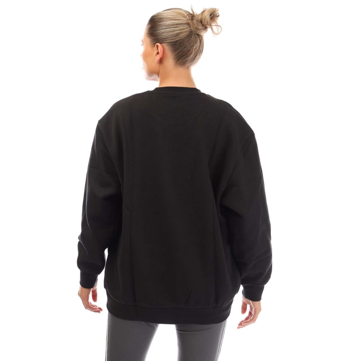 Black crewneck sweatshirt back view with ribbed cuffs and hem