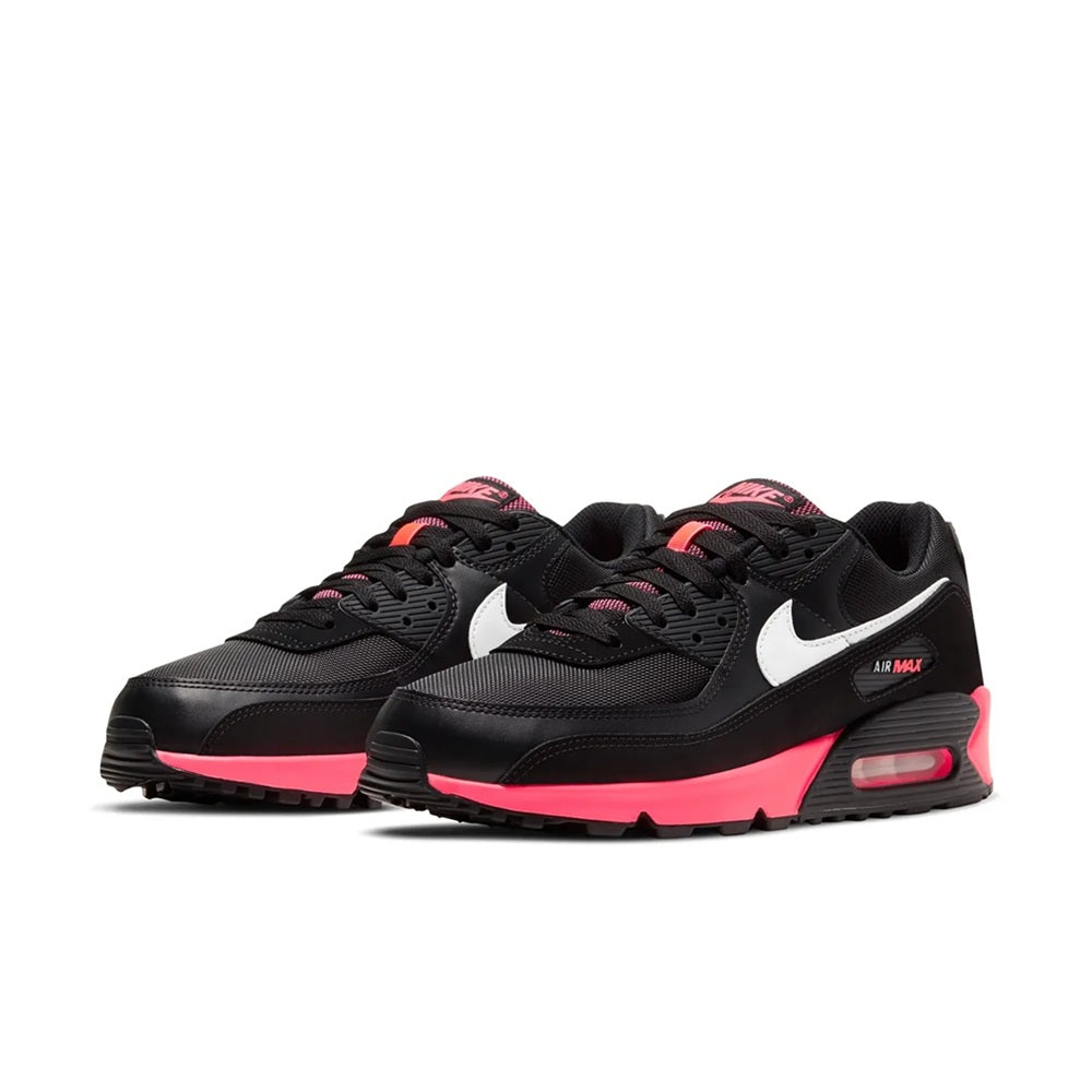 Pair of black Air Max 90 sneakers with white swoosh and racer pink midsole and Air window