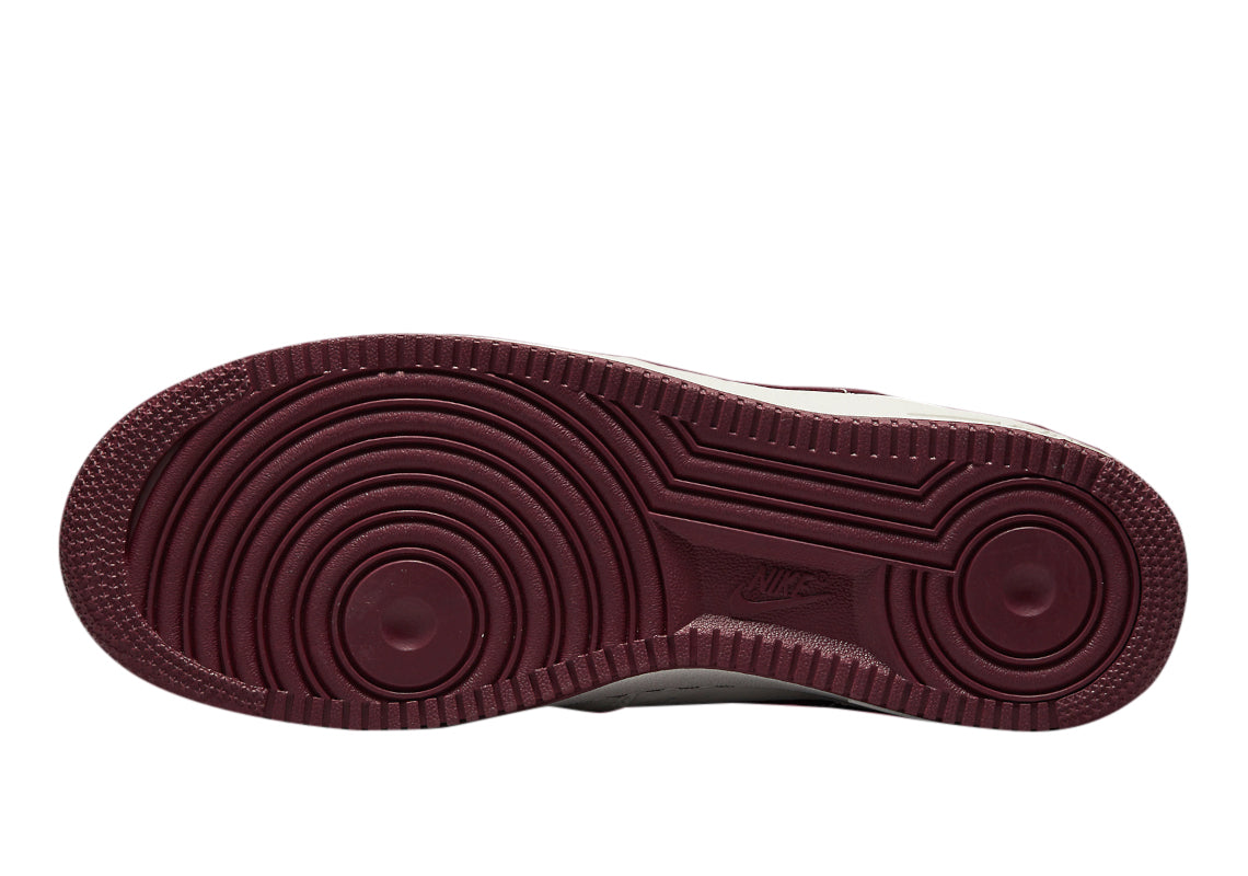 Maroon rubber outsole with herringbone traction grooves