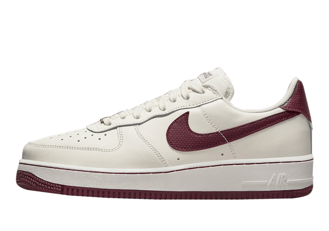 Sail leather low-top sneakers with dark beetroot Swoosh and white laces