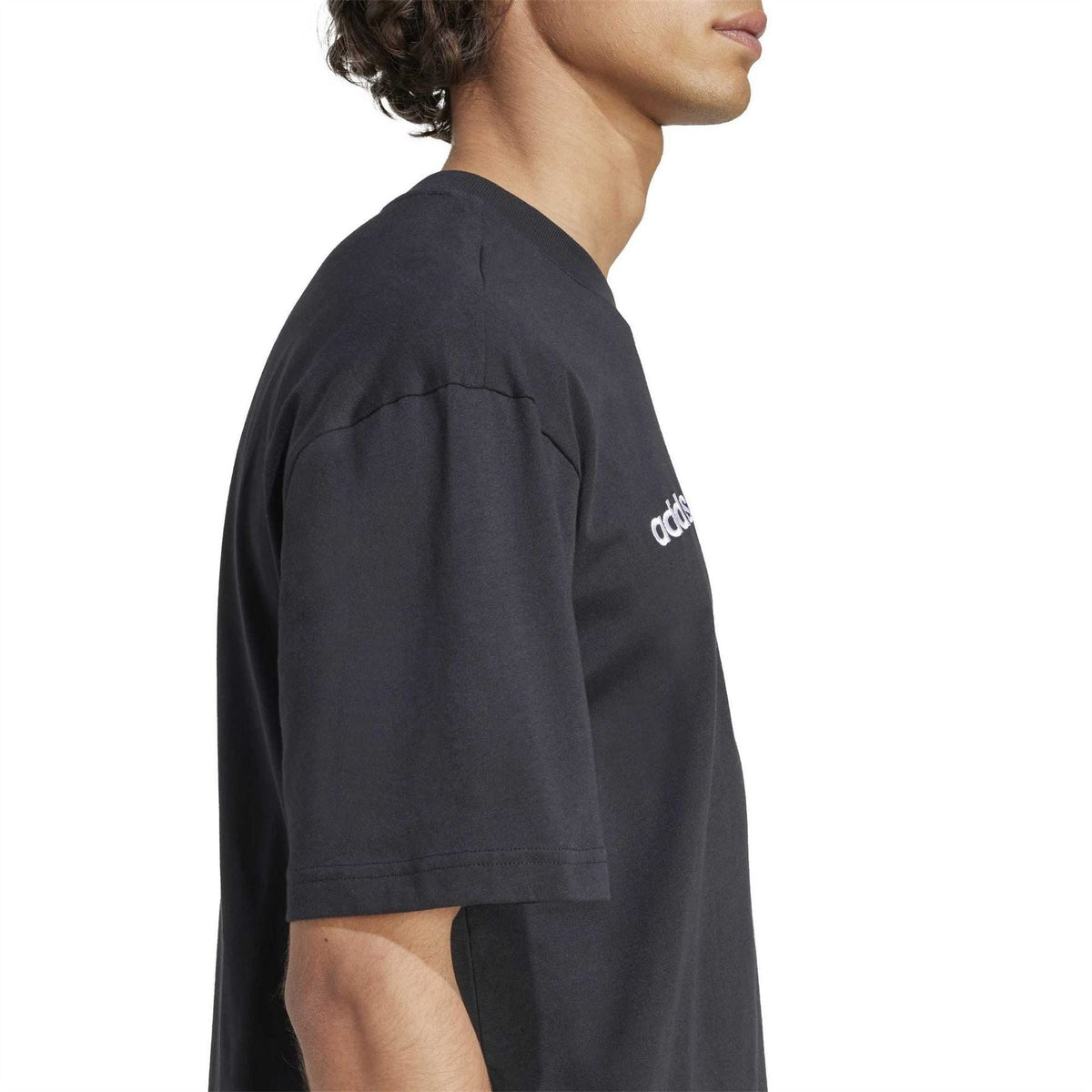 Black short-sleeve crew neck T-shirt, side view with adidas wordmark