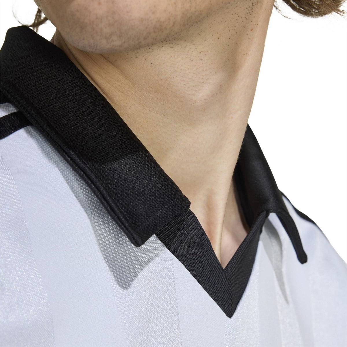 Black collar detail on light blue adidas polo shirt with tie-style neck lacing