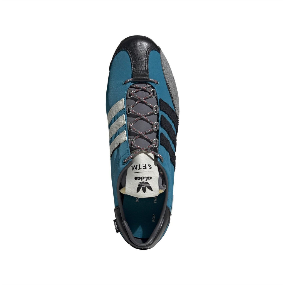 Teal sneaker with black toe and heel, lace-up front with metal eyelets