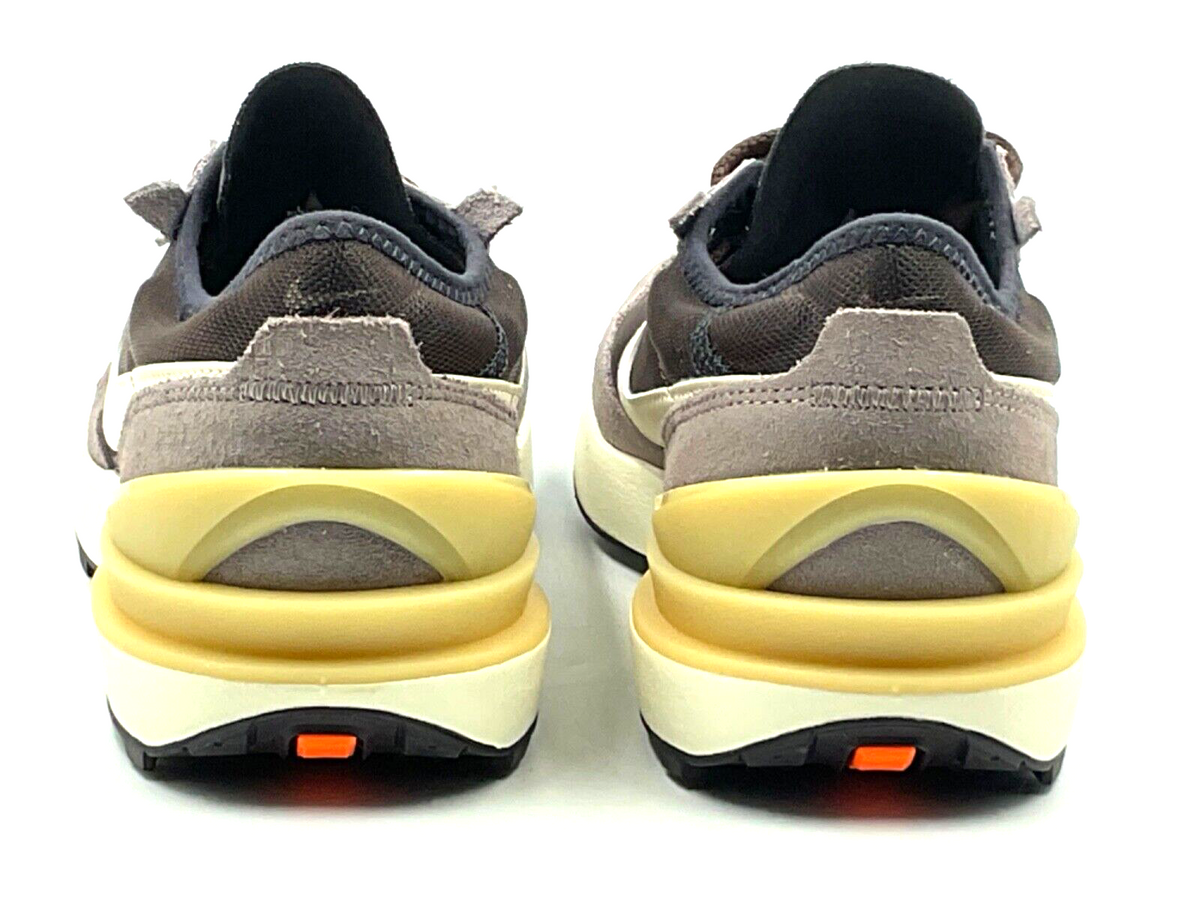 Big Kid's Nike Waffle One heel view, cushioned collar and yellow midsole