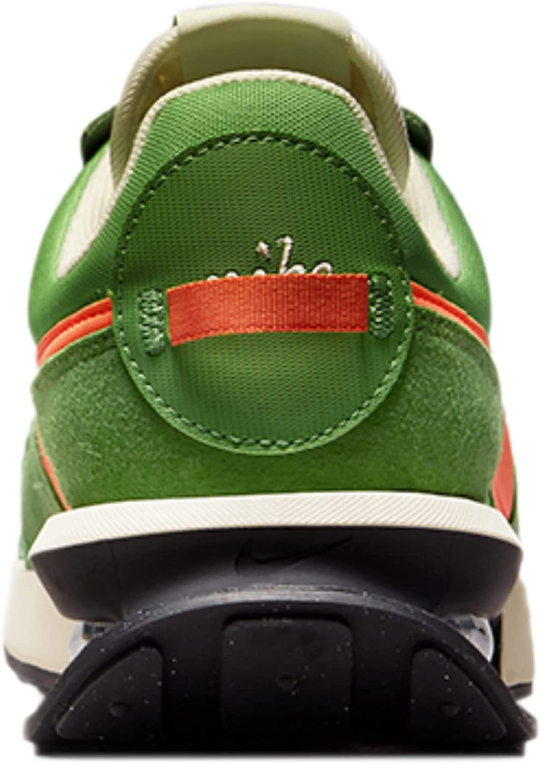 Green Nike sneaker heel with orange pull tab, white midsole, and black cushioned back