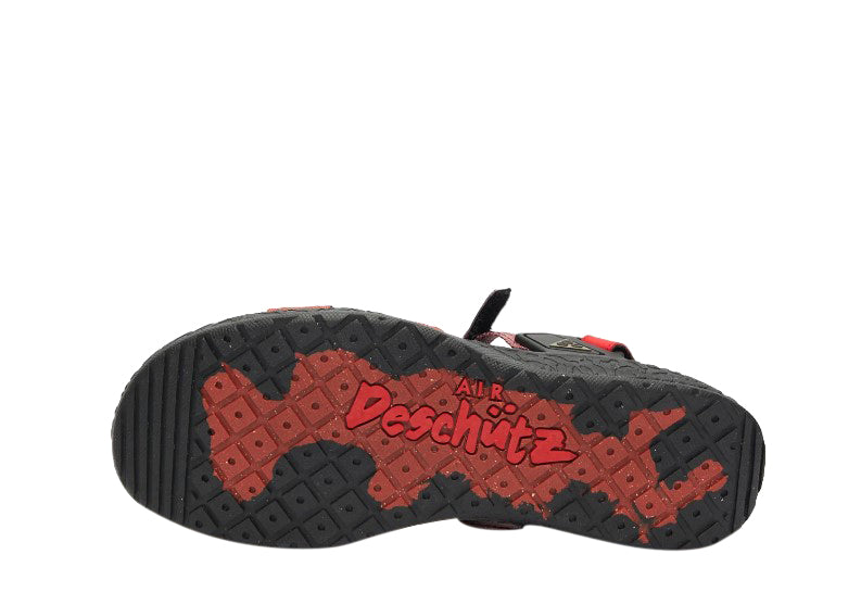 Nike ACG outsole tread with red patterning on black rubber sole