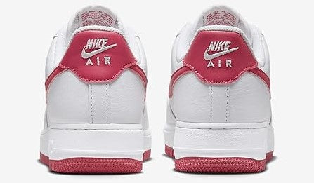 Nike Air Force 1 low-top sneakers, heel view; white leather with pink heel tabs and red soles.