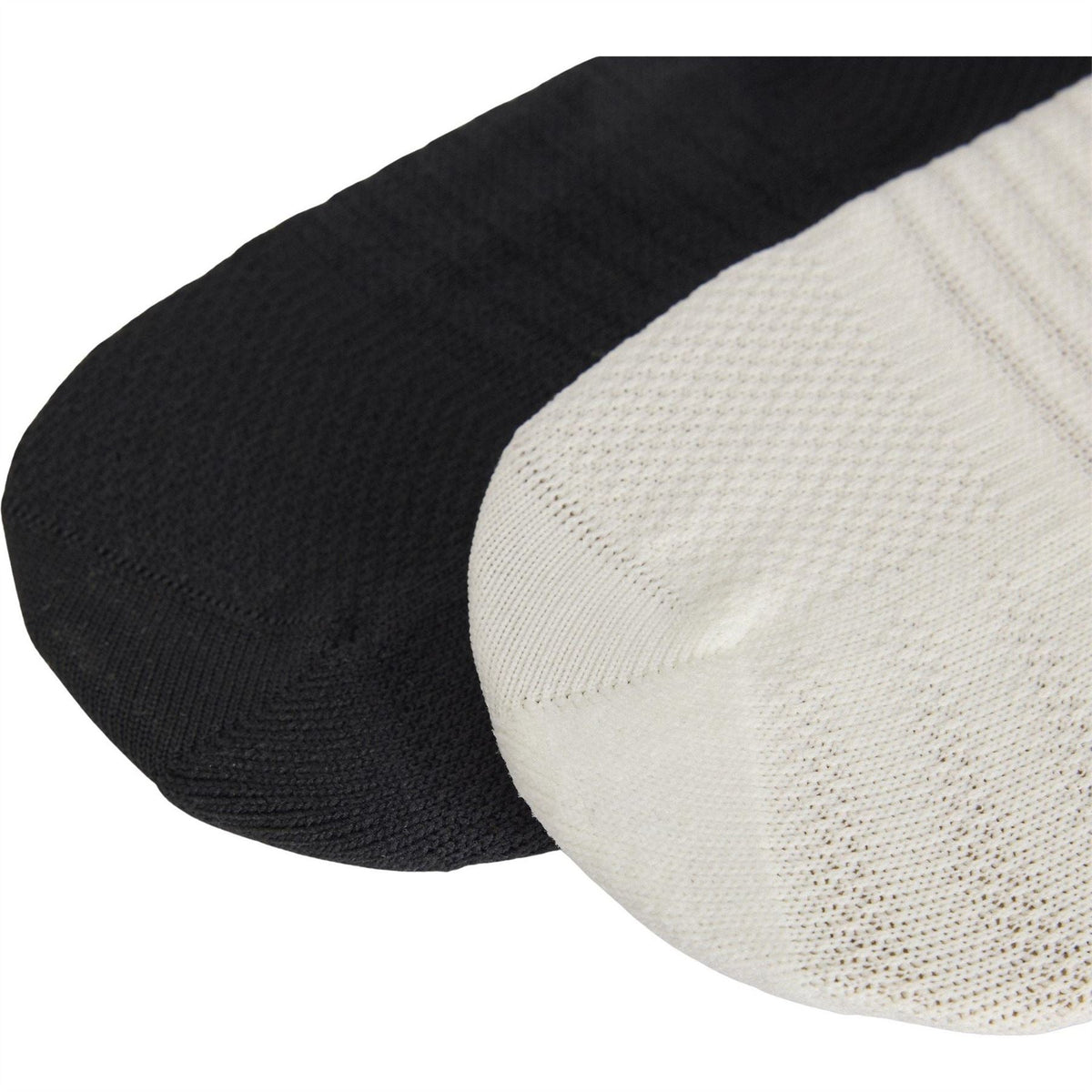 Knit crew socks in black and off-white with cushioned toe and ribbed cuff