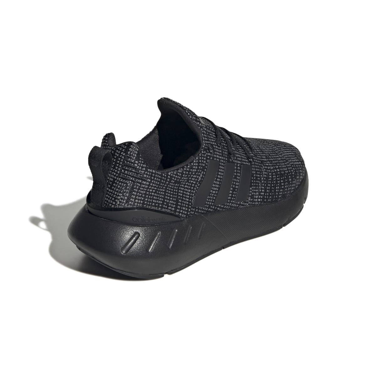 Kids' adidas trainers rear view with dark knit upper and cushioned heel panel