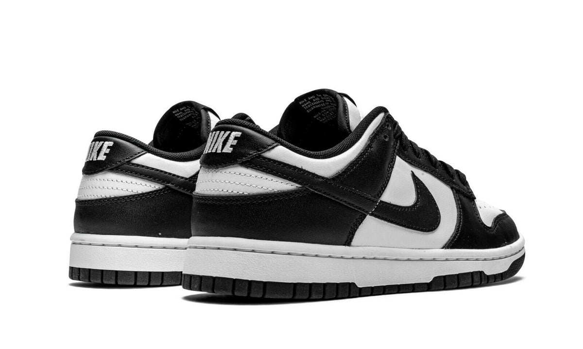 Nike Dunk Low sneakers, heel and tongue view, black lining with white panels and swoosh