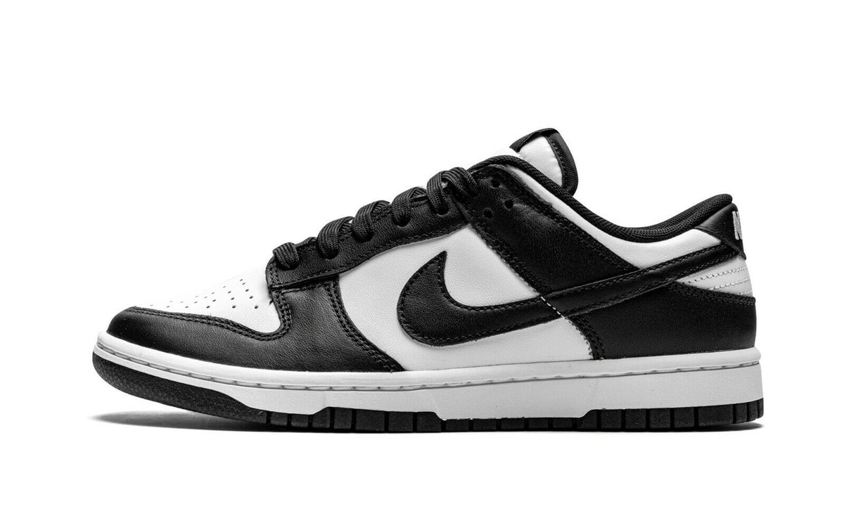 Nike Dunk Low sneakers in black and white with black swoosh and lace-up design