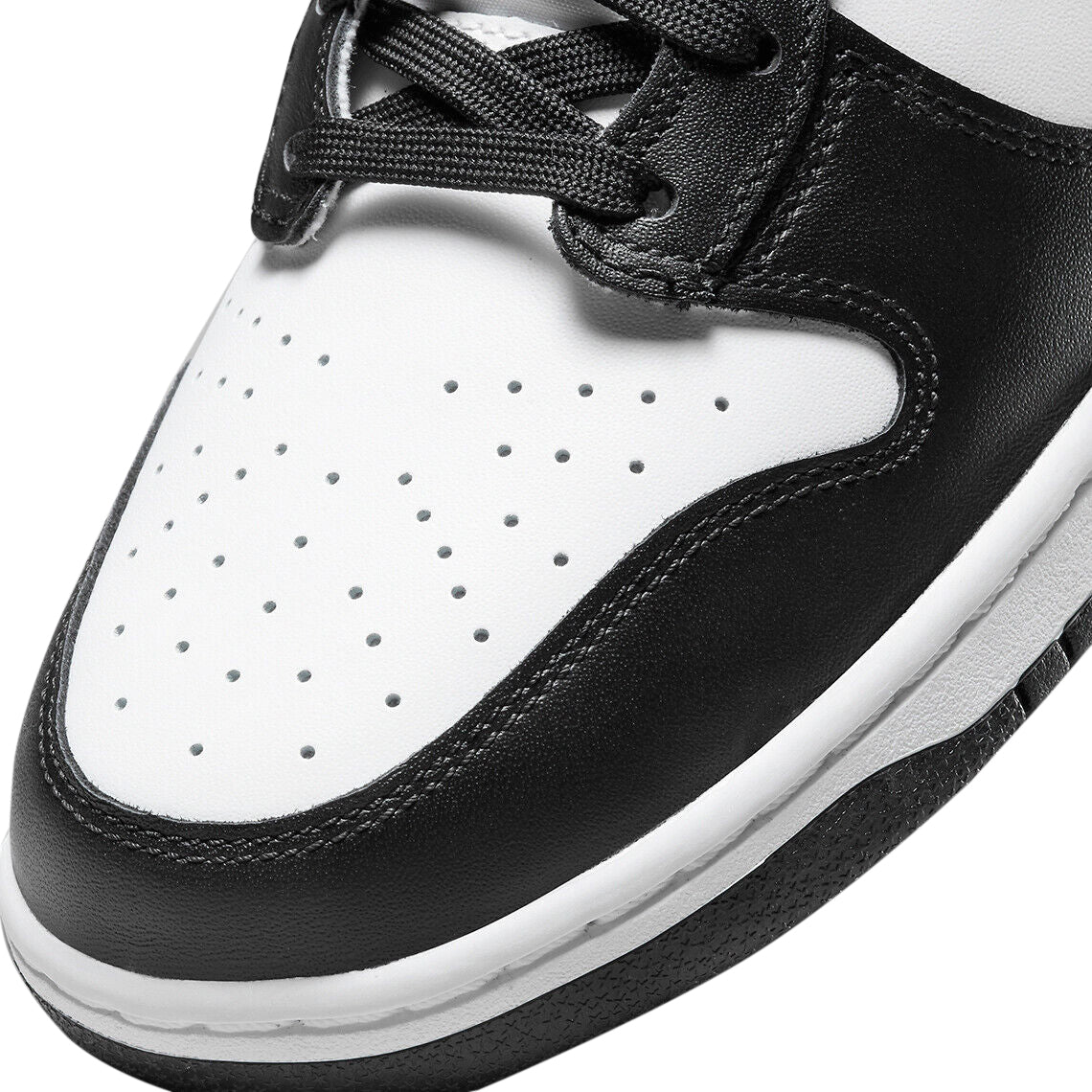 Nike Dunk high-top close-up of white perforated toe and black leather overlay.