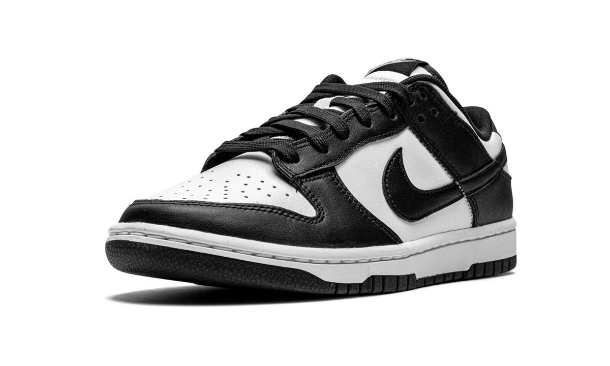 Nike Dunk Low low-top sneakers, black toe and heel, white quarter, laces, and Swoosh.