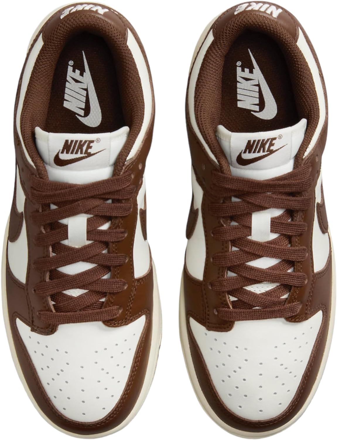 Women’s Nike Dunk Low lace-up sneakers with brown laces, white panels, and Nike tongue tag.