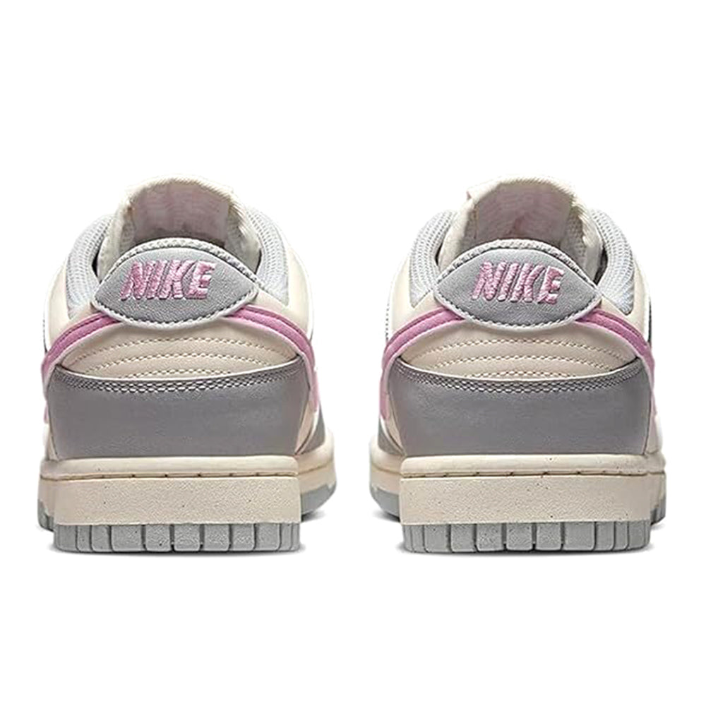 Nike Dunk Low sneakers rear view with grey uppers and pink accent trim