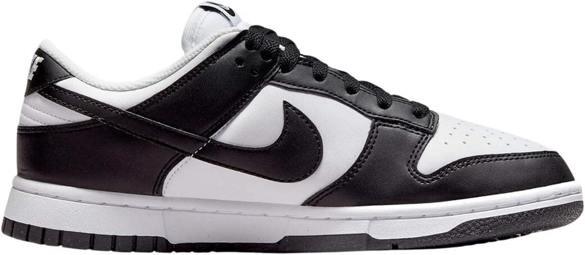 Low-top sneakers with white panels and black overlays, black Swoosh, lace-up front