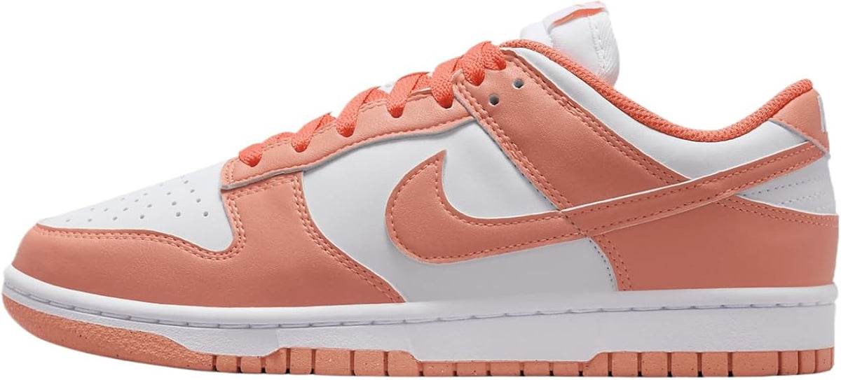 Women's Nike Dunk Low sneakers in white with coral/orange panels and white Swoosh