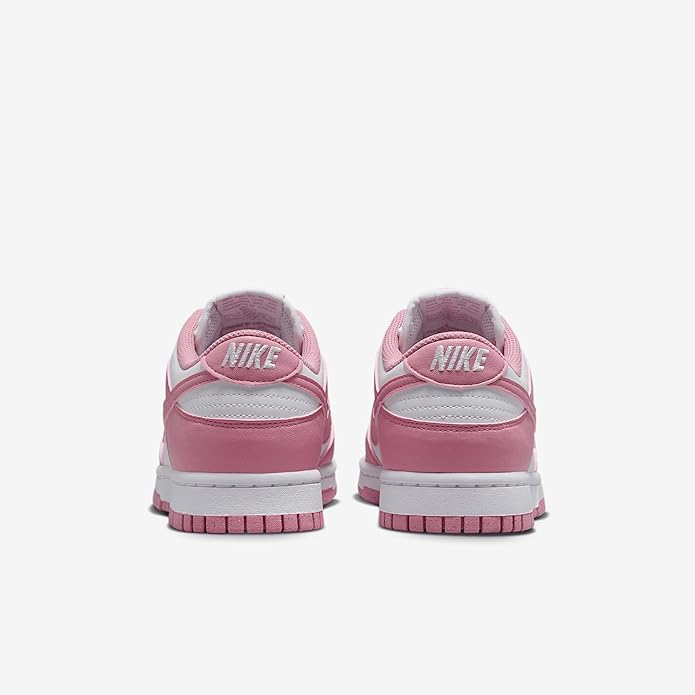 Back view of pink low-top sneakers showing Nike branding on the heel and cushioned sole