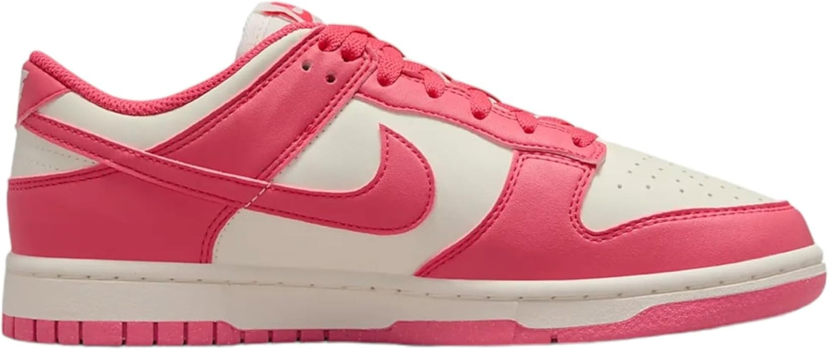 Pink and sail Nike Dunk sneakers with white side panels and pink Swoosh.