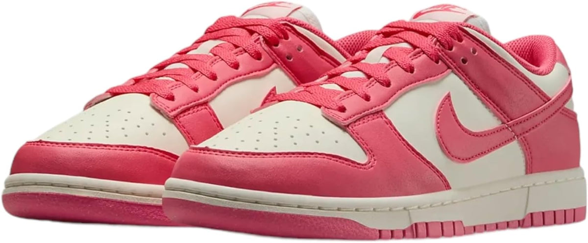 Pink Nike Dunk low-top sneakers with white toe panel and lace-up front.