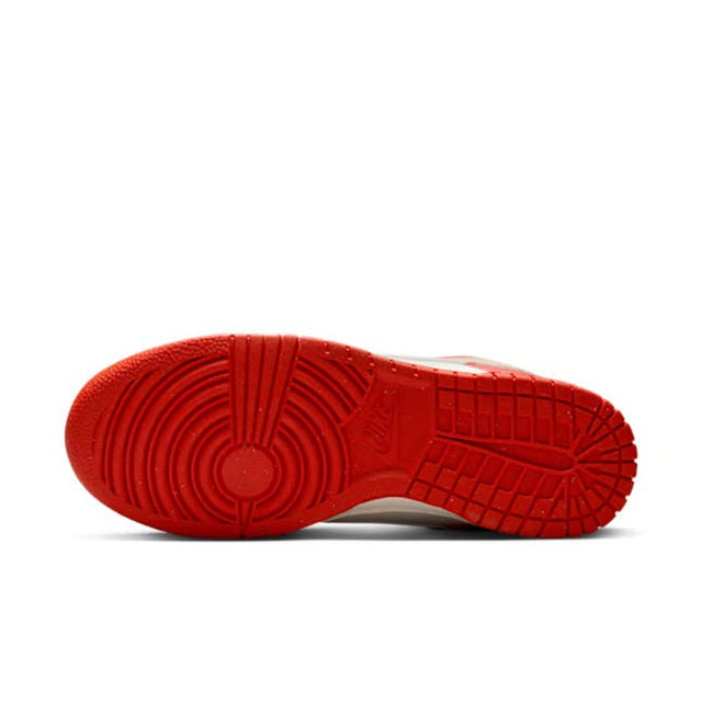 Nike Dunk outsole view with red rubber tread and circular traction pattern