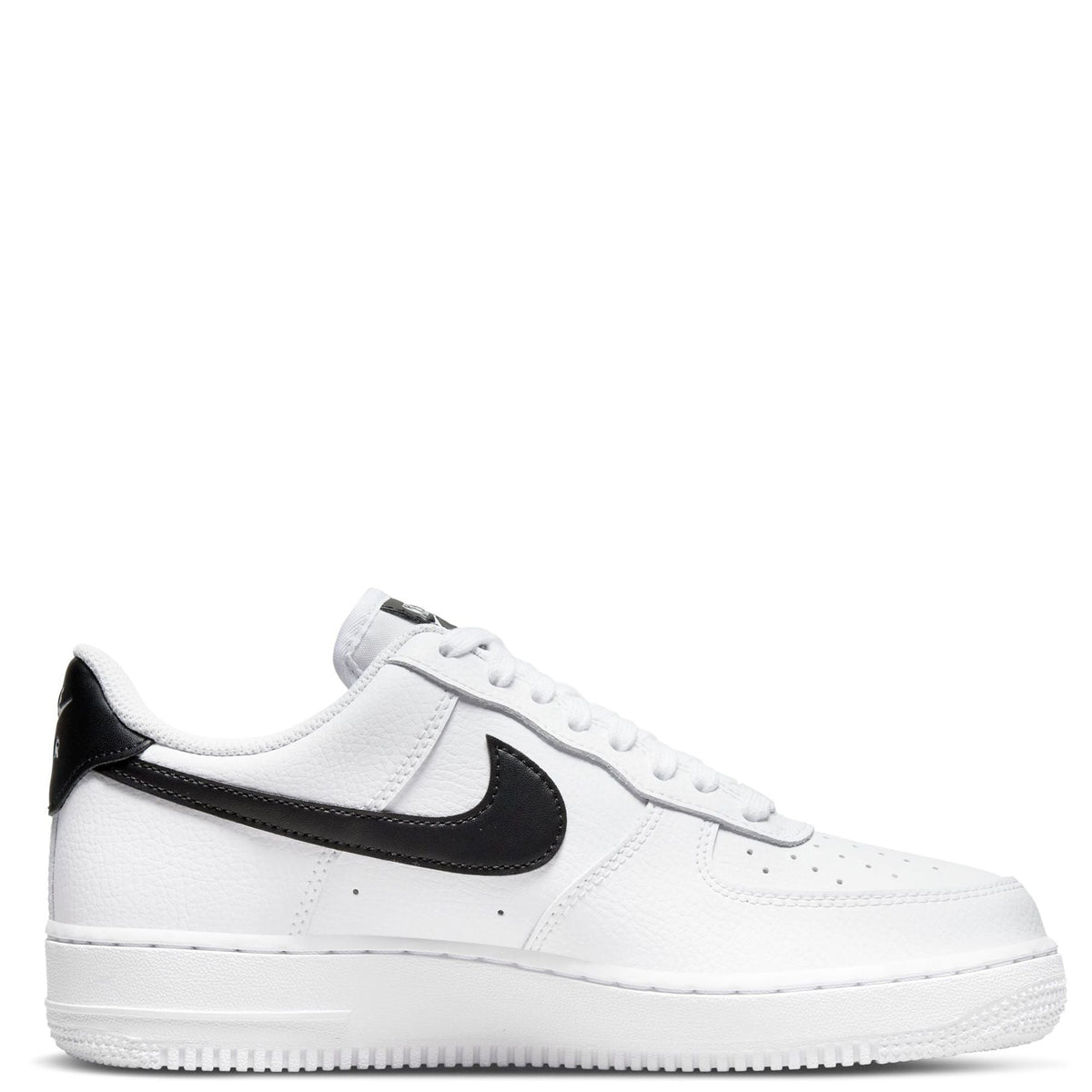 White Nike low-top sneakers with black swoosh, perforated toe, lace-up.
