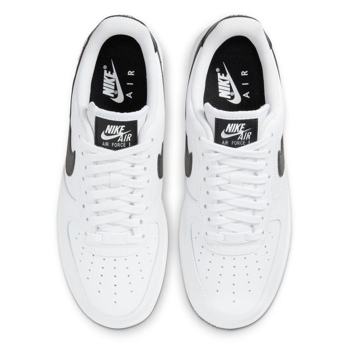 White Nike sneakers with black heel accents and Nike Air tongue labels, lace-up.