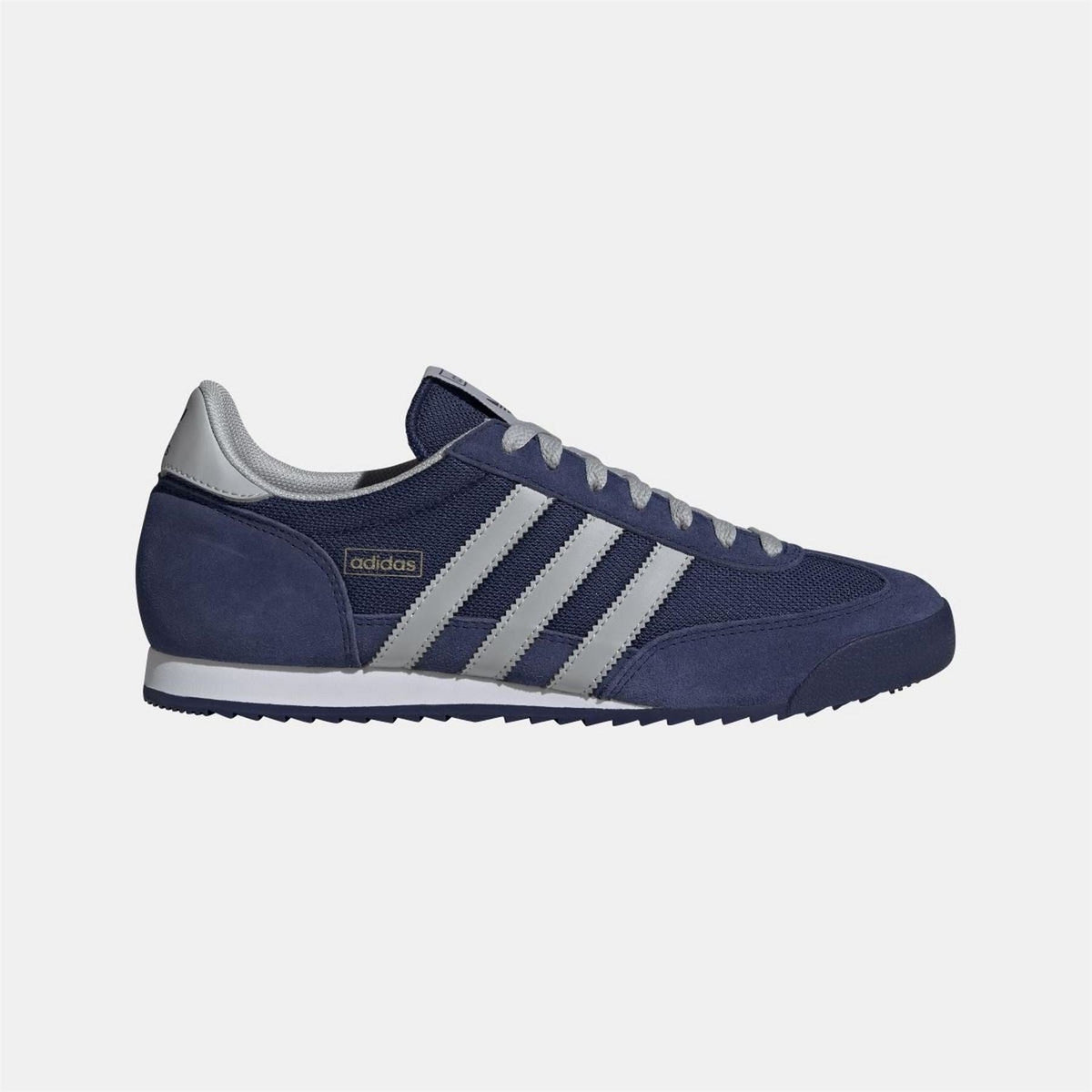 adidas Originals footwear showing classic sneakers with white and black design and textured rubber sole.