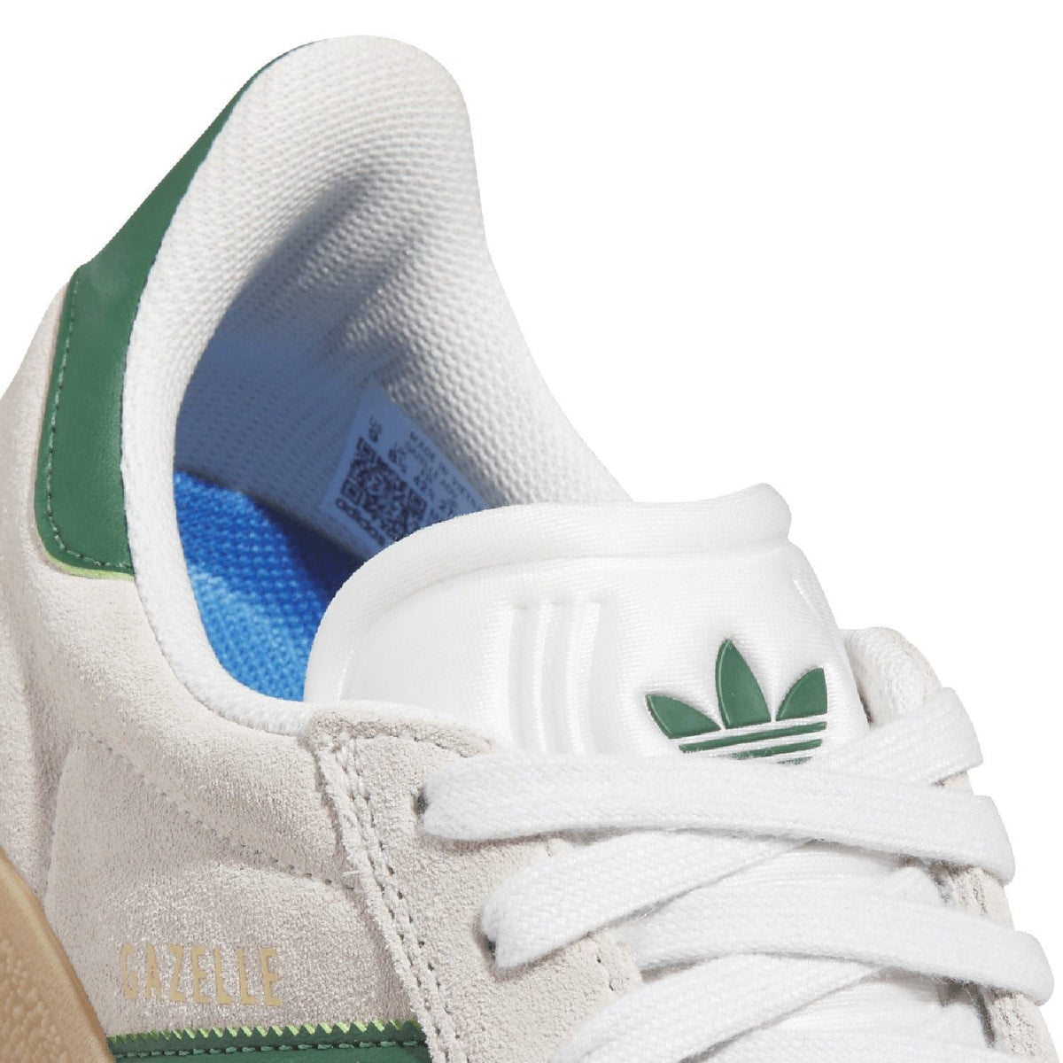 Close-up of adidas Gazelle Advantage heel and laces on off-white leather with green logo