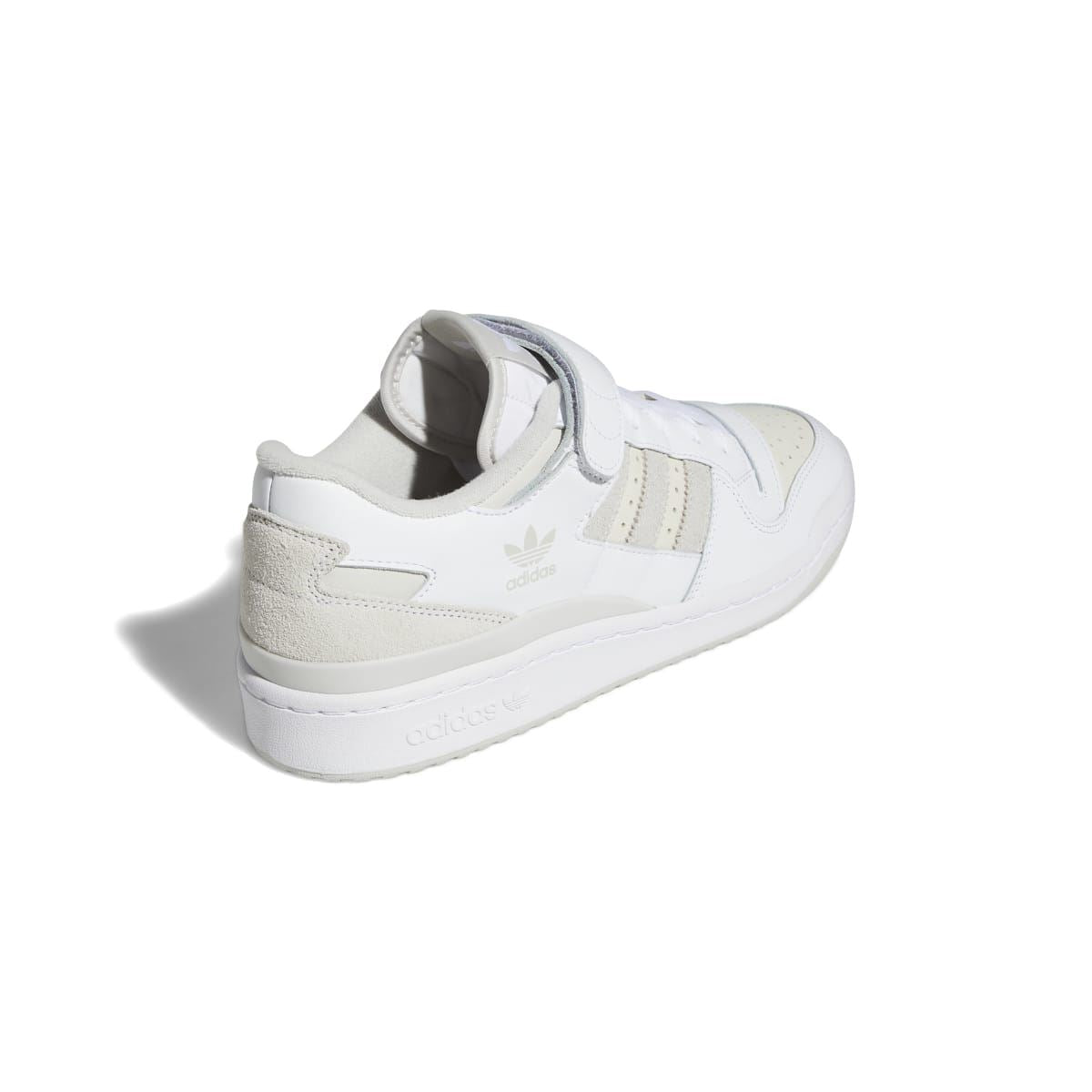 White and grey low-top trainers from the heel side with padded back panel