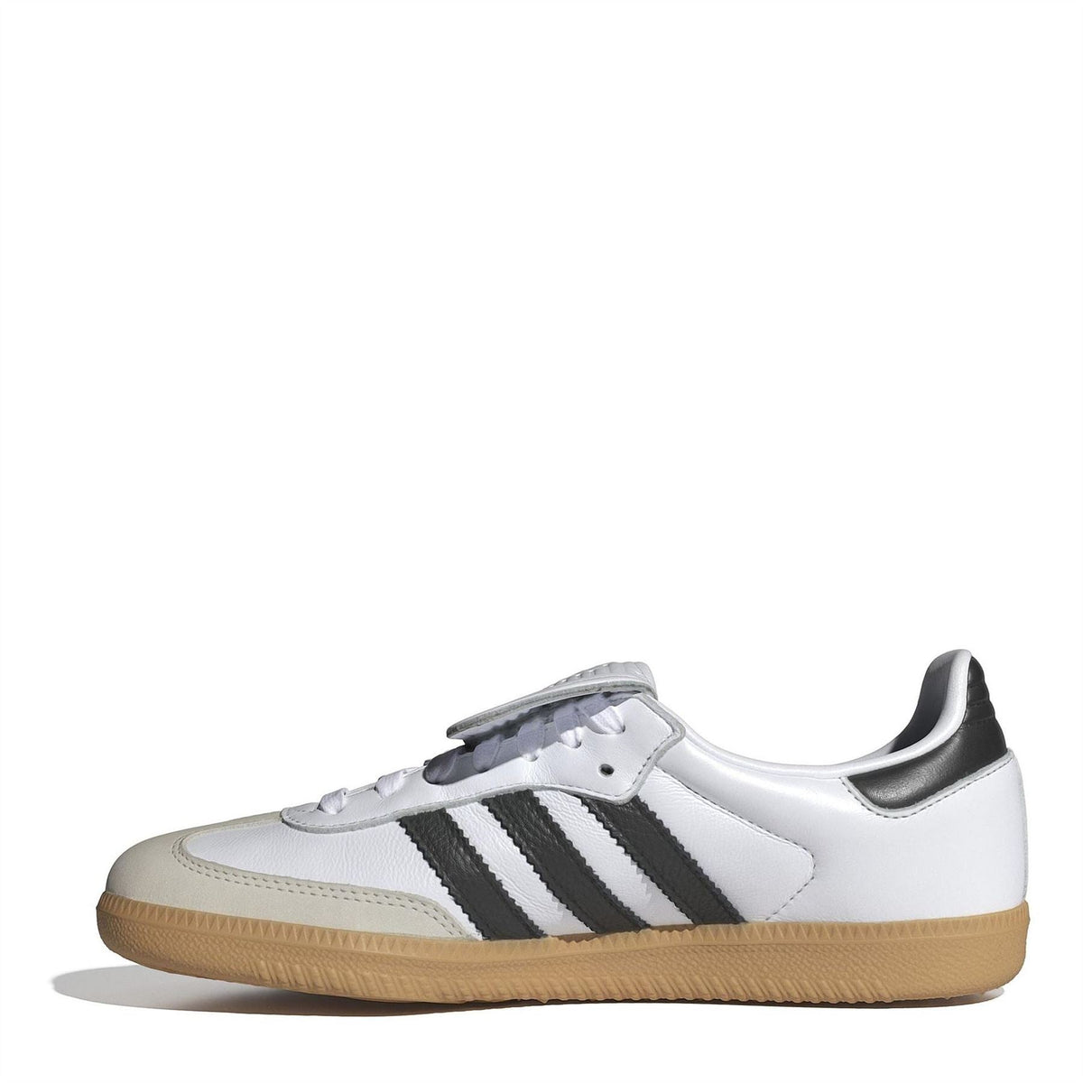 White low-top sneakers with black stripes, lace-up front, and tan gum rubber sole.