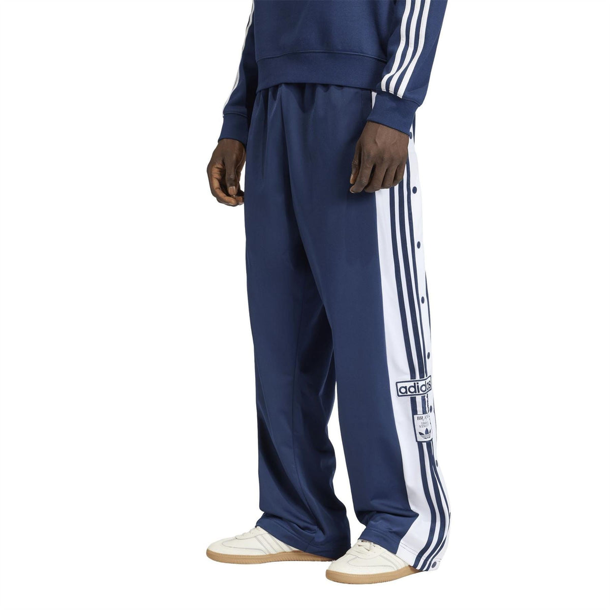 Men's indigo track joggers with elastic cuff and vertical side stripe panels