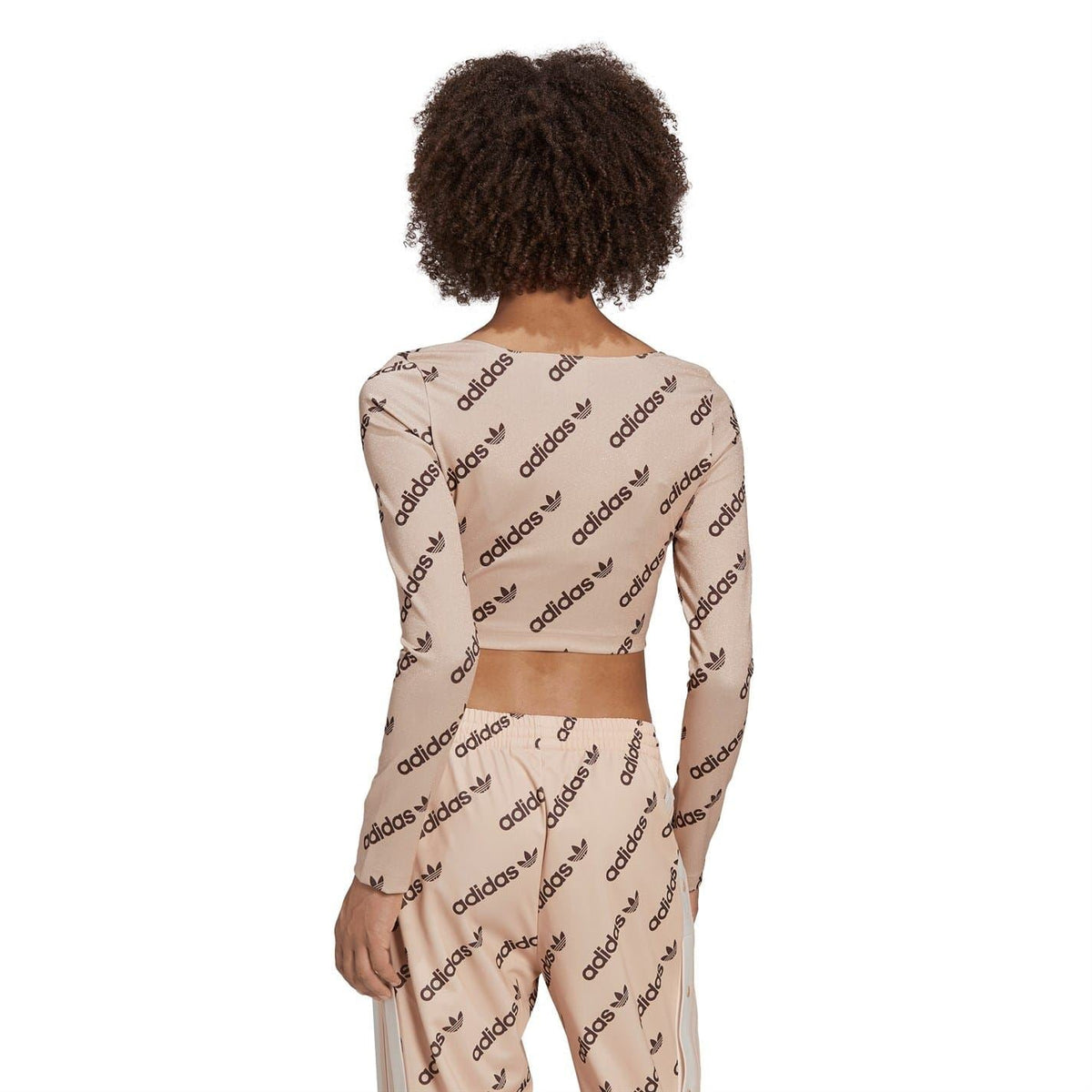 adidas Originals long-sleeve crop top, back view, blush pink with repeating adidas logos