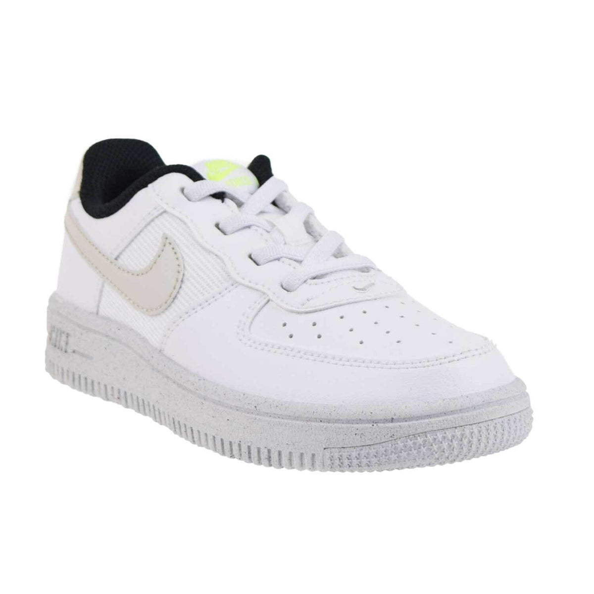 Kids' Nike white sneakers with beige accents, black lining, gray textured midsole
