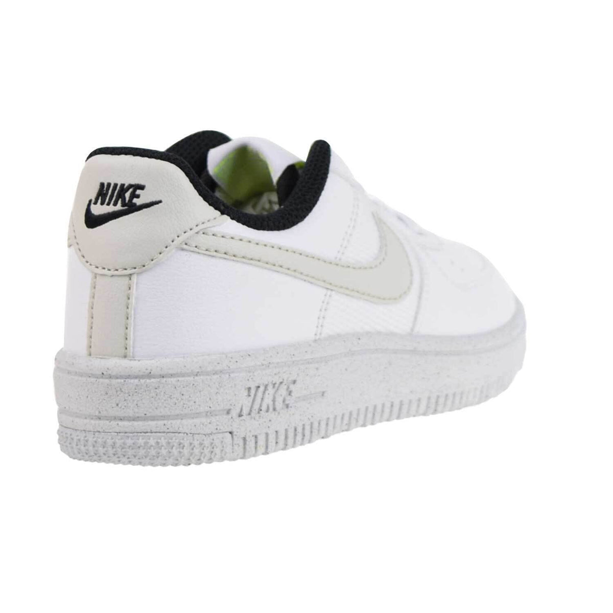 Kids' Nike heel sneakers in white with beige stripes, black collar, gray crater sole