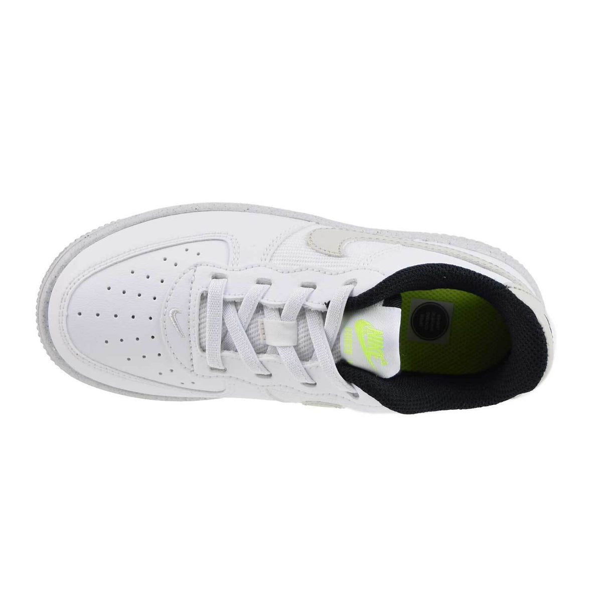 Kids' Nike sneakers with white upper and lace-up, green-tinted lining inside