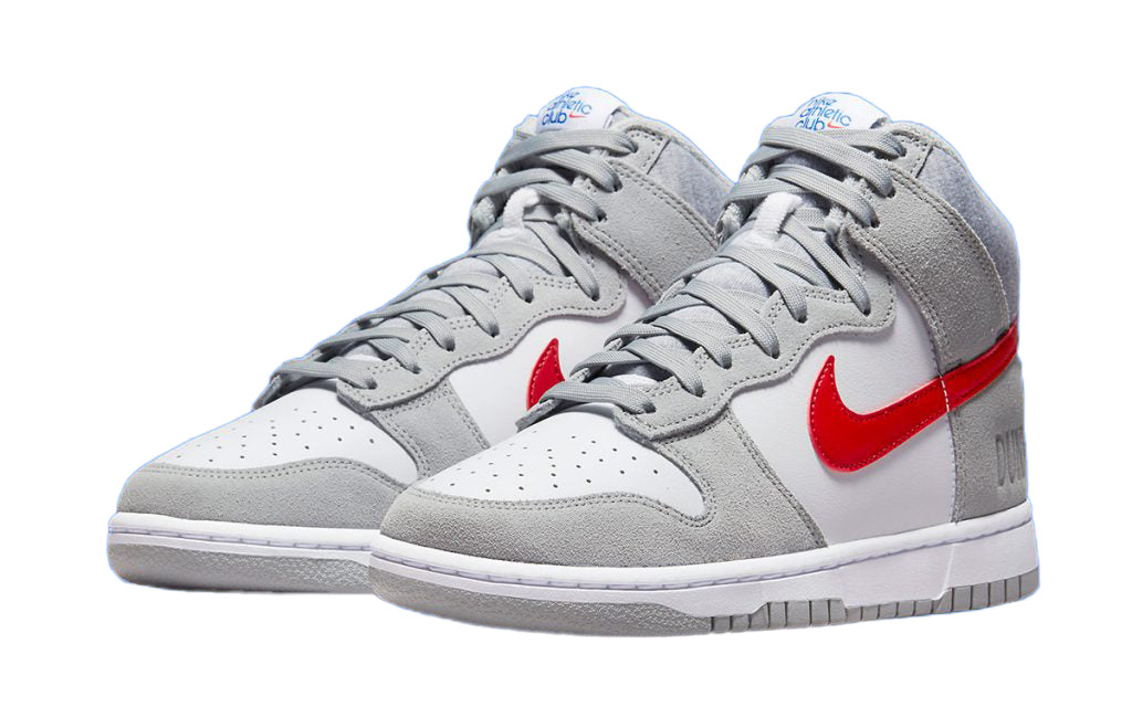 Kids' high-top Nike Dunk sneakers in grey and white with red swoosh, side view pair.