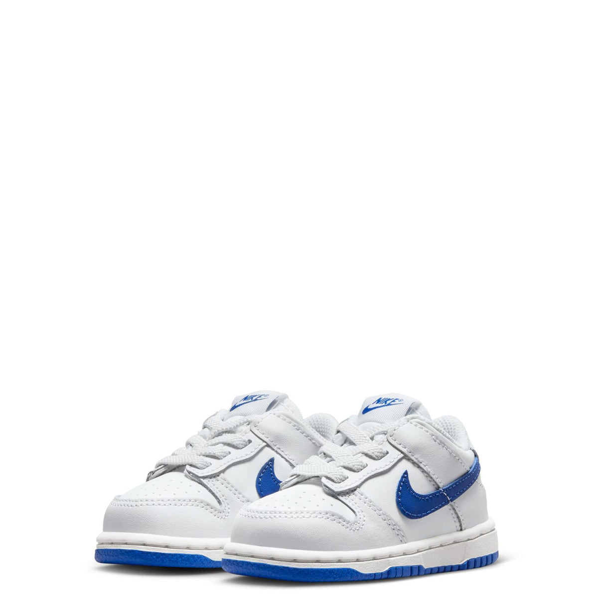 Pair of toddler low-top sneakers, white uppers with blue swooshes and lace-up design