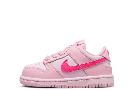 Kids' Nike Dunk Low sneakers in light pink with pink swoosh and laces.
