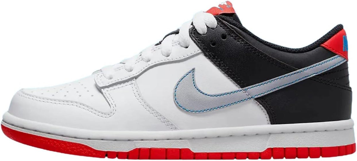 Big kid Nike Dunk Low sneakers side view, white with blue swoosh and red accents